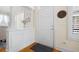 Welcoming foyer featuring beautiful wood floors, elegant wainscoting, and natural light at 109 White Pine Way, Summerville, SC 29485