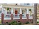 Charming home featuring an inviting front porch, with lush landscaping at 109 White Pine Way, Summerville, SC 29485
