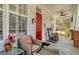 Inviting front porch with comfortable seating and a vibrant red door at 109 White Pine Way, Summerville, SC 29485