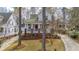 Charming two-story home features a welcoming porch, red front door, and well-maintained landscaping at 109 White Pine Way, Summerville, SC 29485