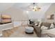 Living room with vaulted ceilings, a comfy couch and an office area in the background at 109 White Pine Way, Summerville, SC 29485