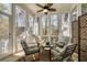Screened-in porch with comfortable outdoor seating and view of the wooded yard at 109 White Pine Way, Summerville, SC 29485