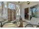 Comfortable screened-in porch with seating, decor, and sliding doors to the interior at 109 White Pine Way, Summerville, SC 29485
