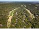 High angle aerial shot of a residential community surrounded by a lush golf course and mature trees at 1121 Summer Wind Ln, Seabrook Island, SC 29455
