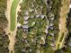 Bird's eye view of a community featuring a golf course, mature trees, and well-maintained streets at 1121 Summer Wind Ln, Seabrook Island, SC 29455