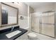 Well-lit bathroom with a modern vanity and shower with sliding glass doors for a clean look at 1121 Summer Wind Ln, Seabrook Island, SC 29455