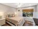 Bright bedroom with wood floors, ceiling fan, and a cozy ambiance for relaxation at 1121 Summer Wind Ln, Seabrook Island, SC 29455