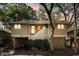 Inviting two-story home with covered parking, front stairs, and a serene, tree-lined setting at 1121 Summer Wind Ln, Seabrook Island, SC 29455