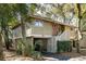 Charming two-story home with beautiful mature trees, front stairs, and covered parking at 1121 Summer Wind Ln, Seabrook Island, SC 29455