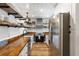 Bright, updated kitchen features stainless appliances and custom shelving at 1121 Summer Wind Ln, Seabrook Island, SC 29455