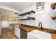 Remodeled kitchen featuring open shelving, wood countertops and stainless appliances at 1121 Summer Wind Ln, Seabrook Island, SC 29455