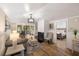 Relaxing living room featuring a fireplace, hardwood floors, and a comfortable seating area at 1121 Summer Wind Ln, Seabrook Island, SC 29455