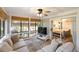 Comfortable sunroom with lots of natural light, comfortable seating, and wood floors at 1121 Summer Wind Ln, Seabrook Island, SC 29455