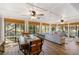Inviting sunroom with beamed ceilings, multiple windows, and comfortable seating at 1121 Summer Wind Ln, Seabrook Island, SC 29455