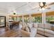 Bright sunroom featuring wood floors, beamed ceilings, and plenty of natural light at 1121 Summer Wind Ln, Seabrook Island, SC 29455
