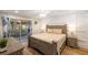 Serene main bedroom with wood floors, paneling, deck access, and neutral decor for relaxation at 1121 Summer Wind Ln, Seabrook Island, SC 29455