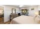 Stylish main bedroom features wood floors, paneled walls, and deck access for a tranquil retreat at 1121 Summer Wind Ln, Seabrook Island, SC 29455