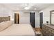 Elegant main bedroom features wood floors, paneled walls, and sliding barn door to private bath at 1121 Summer Wind Ln, Seabrook Island, SC 29455