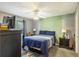 Cozy bedroom featuring a comfortable bed, ceiling fan, and window with natural light at 114 Tennyson Way, Summerville, SC 29486