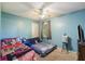 Cozy bedroom with 2 beds, ceiling fan, and natural light providing a comfortable and inviting space at 114 Tennyson Way, Summerville, SC 29486