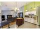 Open living space with a fireplace, kitchen, and dining area providing an inviting layout for easy interaction and entertaining at 114 Tennyson Way, Summerville, SC 29486