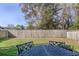 Green backyard with privacy fence and outdoor dining set at 1261 Gannett Rd, Mount Pleasant, SC 29464