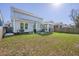 Backyard features a patio, screened porch, and well-maintained lawn, ideal for outdoor living at 1261 Gannett Rd, Mount Pleasant, SC 29464
