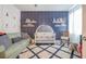 Charming Bedroom featuring a crib, plush rug, comfortable seating, and playful wall decorations, creating a cozy space at 1261 Gannett Rd, Mount Pleasant, SC 29464