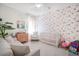 Bright Bedroom with flamingo wallpaper, crib, and pink accents at 1261 Gannett Rd, Mount Pleasant, SC 29464