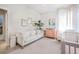 Bright Bedroom with flamingo patterned rug, couch, and pink accents at 1261 Gannett Rd, Mount Pleasant, SC 29464