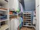 Organized walk-in closet with shelves, rods, and shoe racks, offering ample storage and efficient space utilization at 1261 Gannett Rd, Mount Pleasant, SC 29464