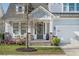 Charming front porch features stone accents, comfortable seating, and tasteful landscaping at 1261 Gannett Rd, Mount Pleasant, SC 29464