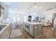 Open-concept kitchen with a center island and stainless steel appliances that adjoins the living area at 1261 Gannett Rd, Mount Pleasant, SC 29464