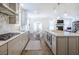 Bright kitchen with stainless steel appliances and a center island that opens to the living area at 1261 Gannett Rd, Mount Pleasant, SC 29464