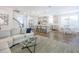 Open-concept living and dining area flowing into a modern kitchen with a large central island at 1261 Gannett Rd, Mount Pleasant, SC 29464