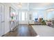 Bright living room with hardwood flooring, chandeliers, and a cozy atmosphere at 1261 Gannett Rd, Mount Pleasant, SC 29464