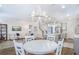 Open-concept living and dining area with direct access to the modern kitchen at 1261 Gannett Rd, Mount Pleasant, SC 29464