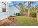 Backyard featuring a well-maintained lawn, wooden fence, and landscaping at 1300 Carol Oaks Dr, Mount Pleasant, SC 29466