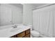 Bathroom featuring a wood vanity, large mirror, and a shower with a white curtain at 1300 Carol Oaks Dr, Mount Pleasant, SC 29466