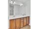 Bathroom vanity with double sinks, wood cabinets, and white countertops at 1300 Carol Oaks Dr, Mount Pleasant, SC 29466