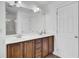 Bathroom vanity with double sinks, wood cabinets, and white countertops at 1300 Carol Oaks Dr, Mount Pleasant, SC 29466