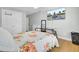 Bright bedroom featuring hardwood floors, mounted television, and closet at 1300 Carol Oaks Dr, Mount Pleasant, SC 29466