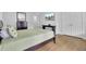 Bedroom featuring a mounted television, closet, and light hardwood floors at 1300 Carol Oaks Dr, Mount Pleasant, SC 29466