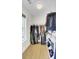 Walk-in closet with wooden floors and an array of shelving and hanging racks at 1300 Carol Oaks Dr, Mount Pleasant, SC 29466