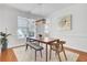 Elegant dining area featuring a modern light fixture and a window view at 1300 Carol Oaks Dr, Mount Pleasant, SC 29466