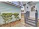 Exterior view of home, featuring a side entrance, walkway, and landscaping at 1300 Carol Oaks Dr, Mount Pleasant, SC 29466