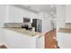 Bright kitchen featuring white cabinets, stainless steel appliances, and hardwood flooring at 1300 Carol Oaks Dr, Mount Pleasant, SC 29466