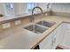 Kitchen sink with a modern faucet and white cabinets, overlooking the backyard at 1300 Carol Oaks Dr, Mount Pleasant, SC 29466