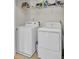 Functional laundry room with a washer, dryer, and a wire rack for storage at 1300 Carol Oaks Dr, Mount Pleasant, SC 29466