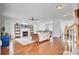 Open living room with a fireplace, hardwood floors, and staircase access at 1300 Carol Oaks Dr, Mount Pleasant, SC 29466